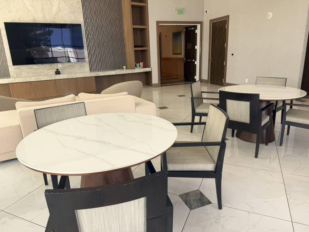 Before, Oct 12, 2026: dining chairs at the marble tables.