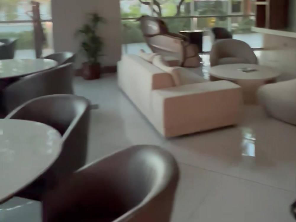 After, Oct 19, 2026 (still from an owner video): leather chairs at the marble tables.